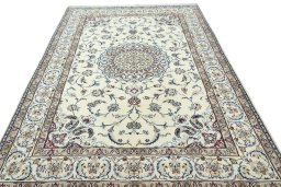 Surface texture of 2000s Nain rug with natural Wool and intricate pattern