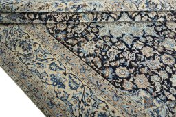 Close-up detail of 2000s Nain rug from Iran / Persia showing Wool weave