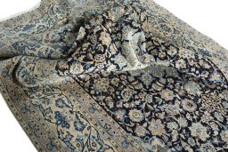 Surface texture of 2000s Nain rug with natural Wool and intricate pattern