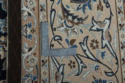 Backside of handmade 2000s Nain rug showing knot structure and weave density