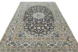 Surface texture of 2000s Nain rug with natural Wool and intricate pattern
