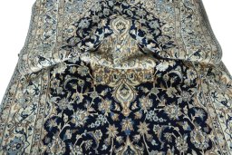 Surface texture of New Nain rug with natural Wool and intricate pattern
