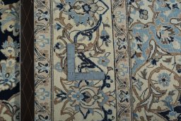 Backside of handmade New Nain rug showing knot structure and weave density