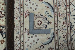 Backside of handmade New Nain rug showing knot structure and weave density