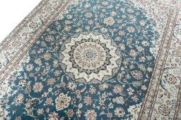 Backside of handmade New Nain rug showing knot structure and weave density