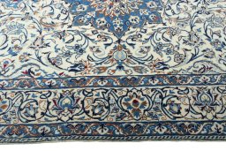 Corner detail of 2000s Nain rug showing border pattern and Wool pile