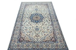 Surface texture of 2000s Nain rug with natural Wool and intricate pattern