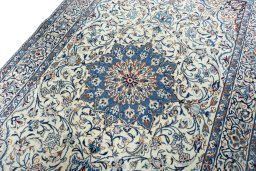 Backside of handmade 2000s Nain rug showing knot structure and weave density