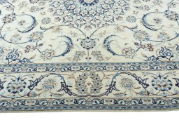 Corner detail of 2000s Nain rug showing border pattern and Wool pile