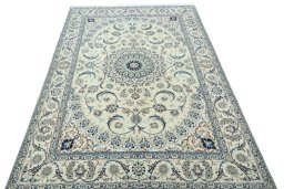 Surface texture of 2000s Nain rug with natural Wool and intricate pattern