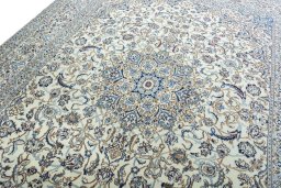 Backside of handmade New Nain rug showing knot structure and weave density
