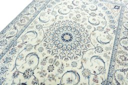 Backside of handmade New Nain rug showing knot structure and weave density