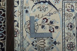 Backside of handmade New Nain rug showing knot structure and weave density