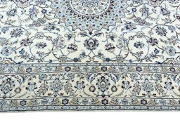 Corner detail of 2000s Nain rug showing border pattern and Wool pile