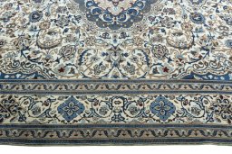 Corner detail of New Nain rug showing border pattern and Wool pile