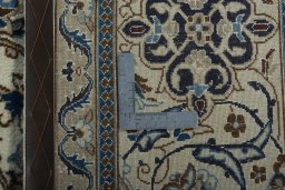 Backside of handmade New Nain rug showing knot structure and weave density