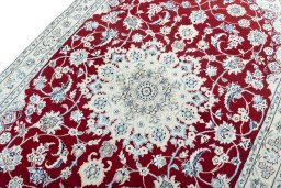 Backside of handmade New Nain rug showing knot structure and weave density