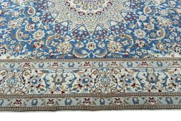 Corner detail of 2000s Nain rug showing border pattern and Wool pile