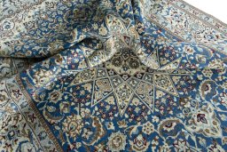 Surface texture of 2000s Nain rug with natural Wool and intricate pattern