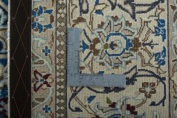Backside of handmade 2000s Nain rug showing knot structure and weave density