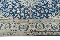 Corner detail of 2000s Nain rug showing border pattern and Wool pile