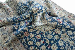 Surface texture of 2000s Nain rug with natural Wool and intricate pattern