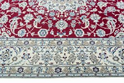 Corner detail of 2000s Nain rug showing border pattern and Wool pile
