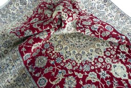 Surface texture of 2000s Nain rug with natural Wool and intricate pattern
