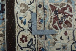 Backside of handmade 2000s Nain rug showing knot structure and weave density