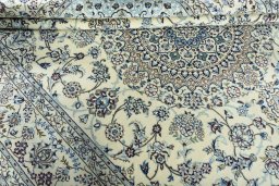 Close-up detail of 2000s Nain rug from Iran / Persia showing Wool weave