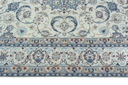 Corner detail of 2000s Nain rug showing border pattern and Wool pile