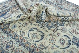 Surface texture of 2000s Nain rug with natural Wool and intricate pattern