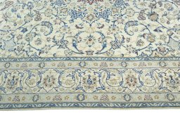 Corner detail of 2000s Nain rug showing border pattern and Wool pile