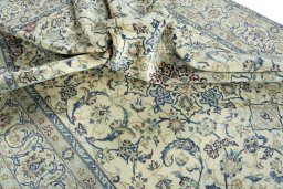 Surface texture of 2000s Nain rug with natural Wool and intricate pattern