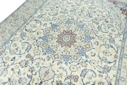Backside of handmade 2000s Nain rug showing knot structure and weave density