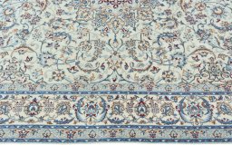 Corner detail of 2000s Nain rug showing border pattern and Wool pile