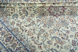 Close-up detail of 2000s Nain rug from Iran / Persia showing Wool weave