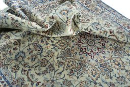 Surface texture of 2000s Nain rug with natural Wool and intricate pattern