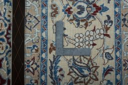 Backside of handmade 2000s Nain rug showing knot structure and weave density