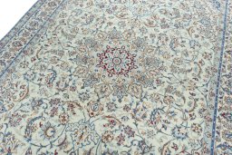 Backside of handmade 2000s Nain rug showing knot structure and weave density