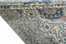 Corner detail of 2000s Nain rug showing border pattern and Wool pile