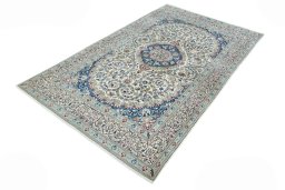 Corner detail of 2000s Nain rug showing border pattern and Wool pile