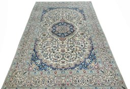 Surface texture of 2000s Nain rug with natural Wool and intricate pattern