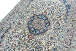 Backside of handmade 2000s Nain rug showing knot structure and weave density