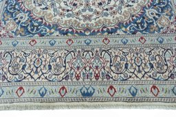Close-up detail of 2000s Nain rug from Iran / Persia showing Wool weave