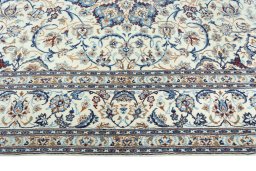 Corner detail of 2000s Nain rug showing border pattern and Wool pile