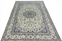 Surface texture of 2000s Nain rug with natural Wool and intricate pattern