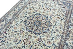 Backside of handmade 2000s Nain rug showing knot structure and weave density