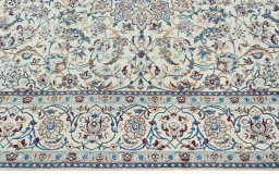 Corner detail of 2000s Nain rug showing border pattern and Wool pile