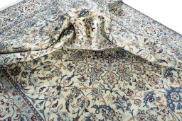 Surface texture of 2000s Nain rug with natural Wool and intricate pattern